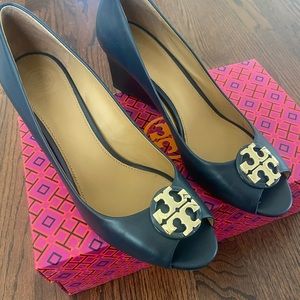 Beautiful Tory Burch size 8 navy peep toe wedges.